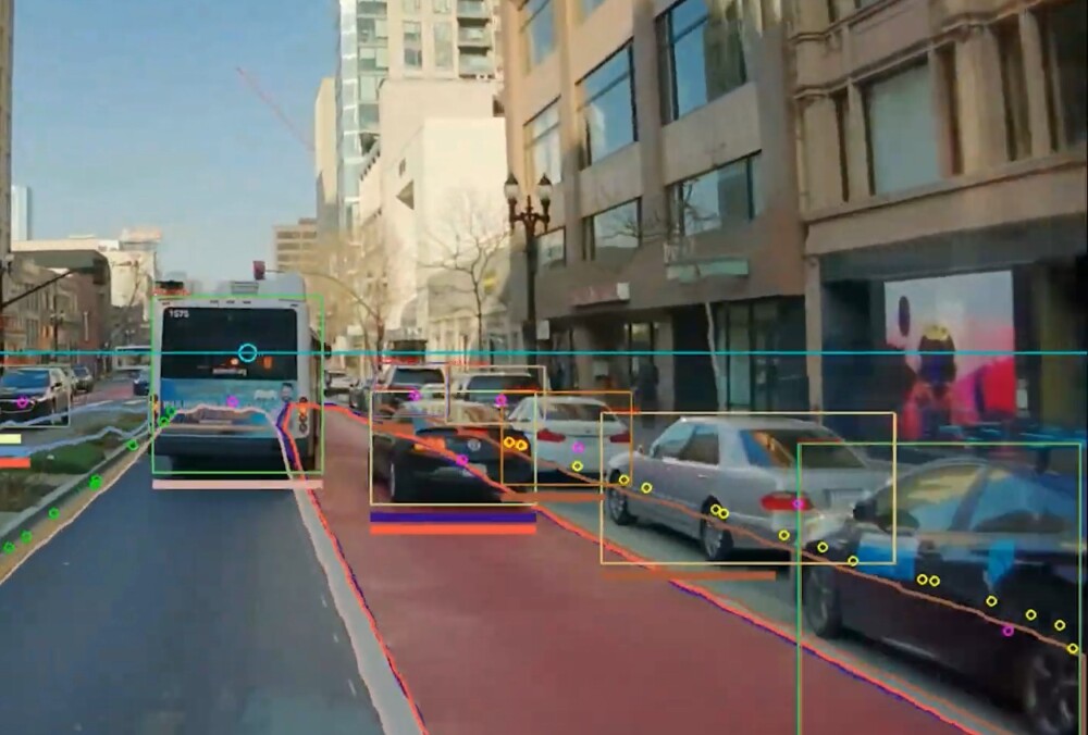 A street in Oakland, Calif., viewed through AI-enhanced cameras from the start-up Hayden AI. Transit agencies across the U.S. are deploying the company's systems to keep bus lanes clear of illegally parked cars. (Hayden AI)