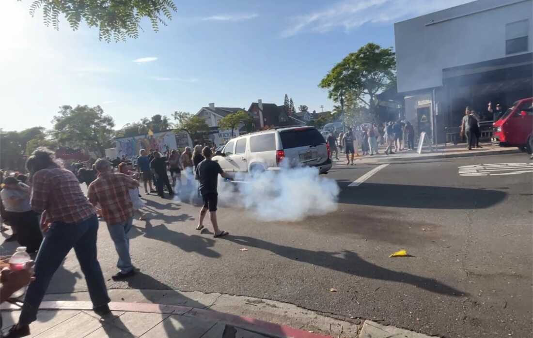 ICE agents used what appeared to be a smoke device to disperse the crowd near Buona Forchetta on Friday.