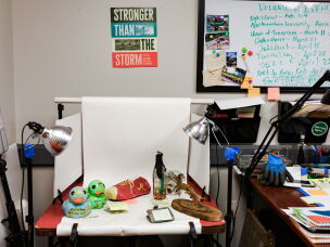 The work of reuniting objects with flood survivors is painstaking. Mandy Wallace uses special solutions and tools to clean the items and restore moldy and mud-caked photos in her office outside Asheville, N.C.