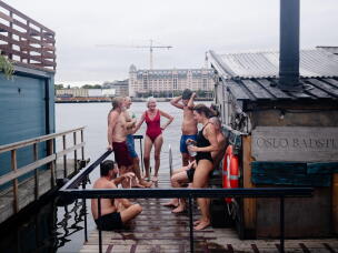 Sauna enthusiasts enjoy an early morning sauna session during the International Sauna Congress 2026 in Oslo, Norway, Sept. 25, 2026. In Oslo Harbor, next to the Opera House and the Munch Museum, lies Sukkerbiten — the Oslo Sauna Association's cluster of many small saunas in a variety of styles, lined up along the pier.