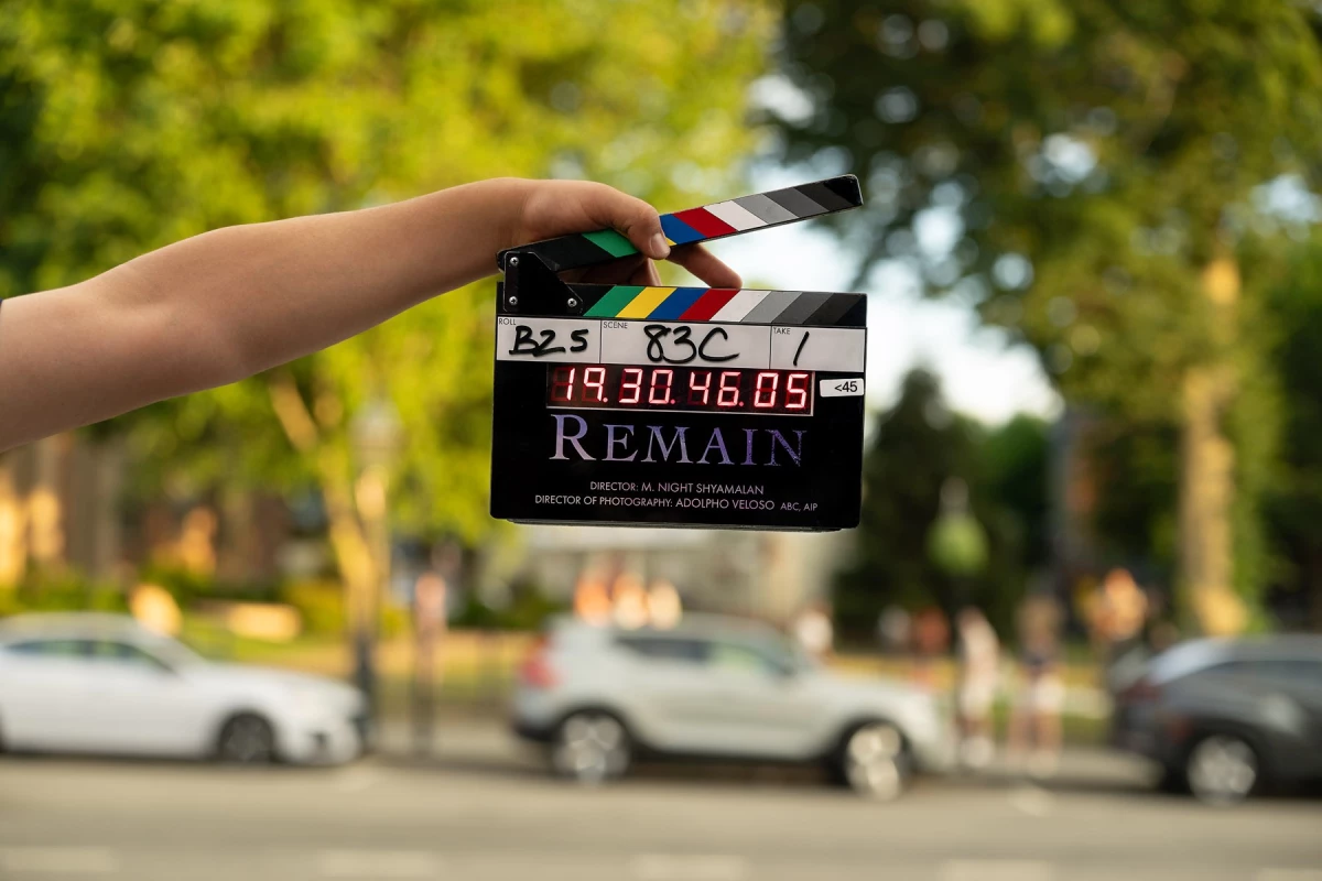 A clapboard is shown on the set of Remain, an M. Night Shyamalan film due in theaters in October 2026 created from a story jointly developed with novelist Nicholas Sparks.