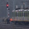 Investigators examine a rail line damaged in an explosion in Mika, Poland, on November 17, 2025.