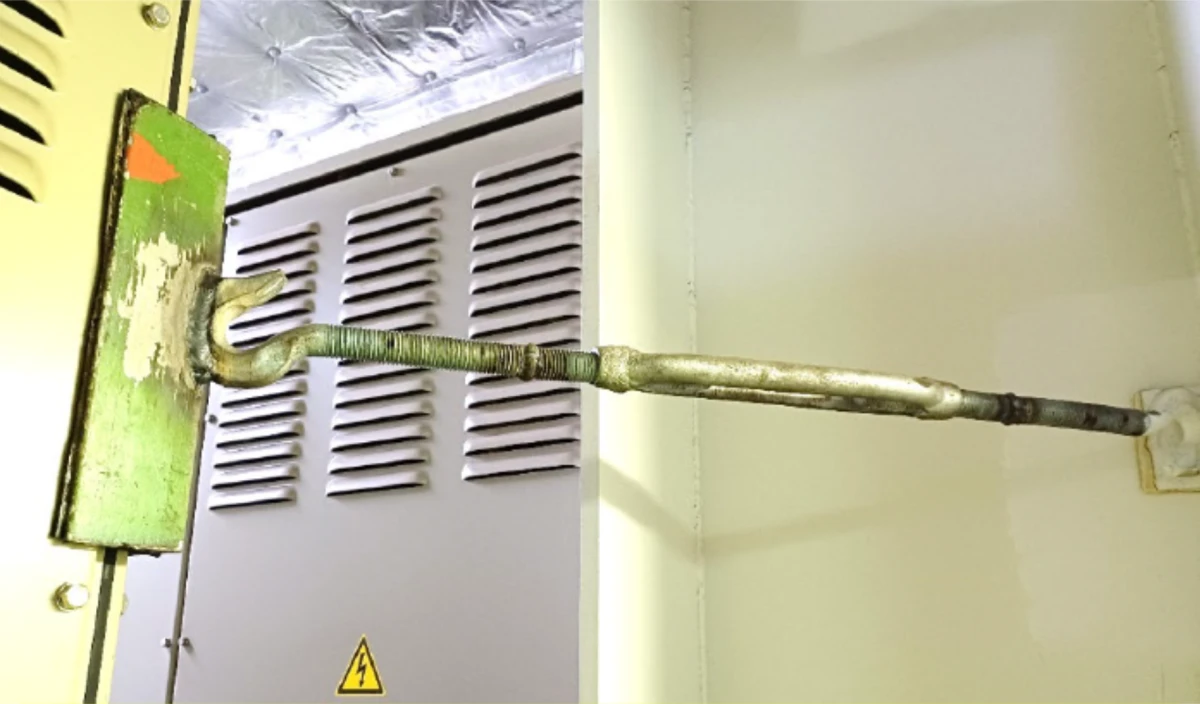 An image from a Justice Department court filing shows a cargo chain turnbuckle welded to an angled piece of metal wedged between a transformer (left) and a steel beam (right) aboard the Dali, in an apparent attempt to dampen vibrations that can damage electrical equipment.