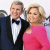 Todd and Julie Chrisley pose on a red carpet in 2017.