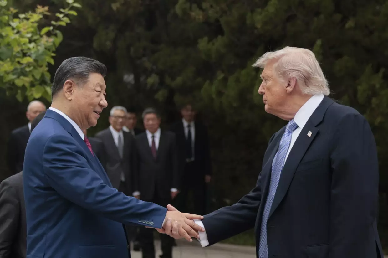 President Trump shakes hands with China's President Xi Jinping as he leaves after a visit to Zhongnanhai Garden in Beijing on May 15.
