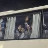 Palestinian prisoners deported outside the Palestinian Territories wave after being released from Israeli prison, following a ceasefire agreement between Israel and Hamas, as they arrive at the Egyptian side of the Rafah border crossing between Egypt and the Gaza Strip, Feb. 27.