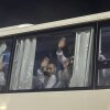 Palestinian prisoners deported outside the Palestinian Territories wave after being released from Israeli prison, following a ceasefire agreement between Israel and Hamas, as they arrive at the Egyptian side of the Rafah border crossing between Egypt and the Gaza Strip, Feb. 27.