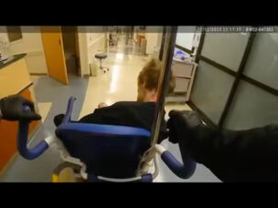 In video footage released by the Milwaukie Police Department, an officer can be seen rolling Descamps in a wheelchair to exit the hospital emergency room.