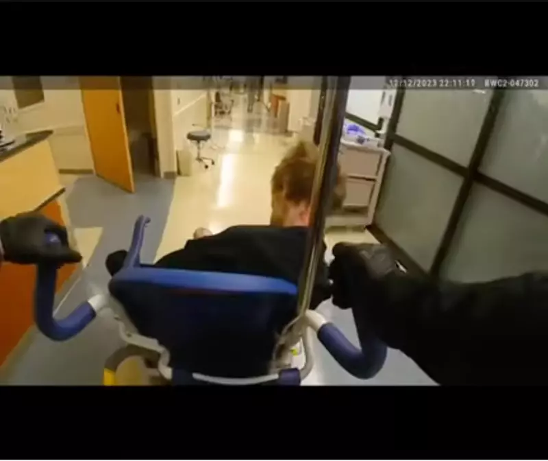 In video footage released by the Milwaukie Police Department, an officer can be seen rolling Descamps in a wheelchair to exit the hospital emergency room.