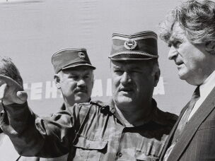 Bosnian Serb General Ratko Mladic (center) speaks with Bosnian Serb President Radovan Karadzic (right) in the Bosnian town of Banja Luka, in 1994.