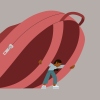 A young student struggles to carry a large heavy backpack, symbolizing the worries that can accompany the transition back-to-school.