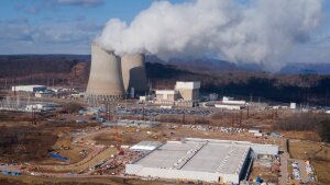 A data center owned by Amazon Web Services, front right, is under construction next to the Susquehanna nuclear power plant in Berwick, Pa., Jan. 14, 2025.