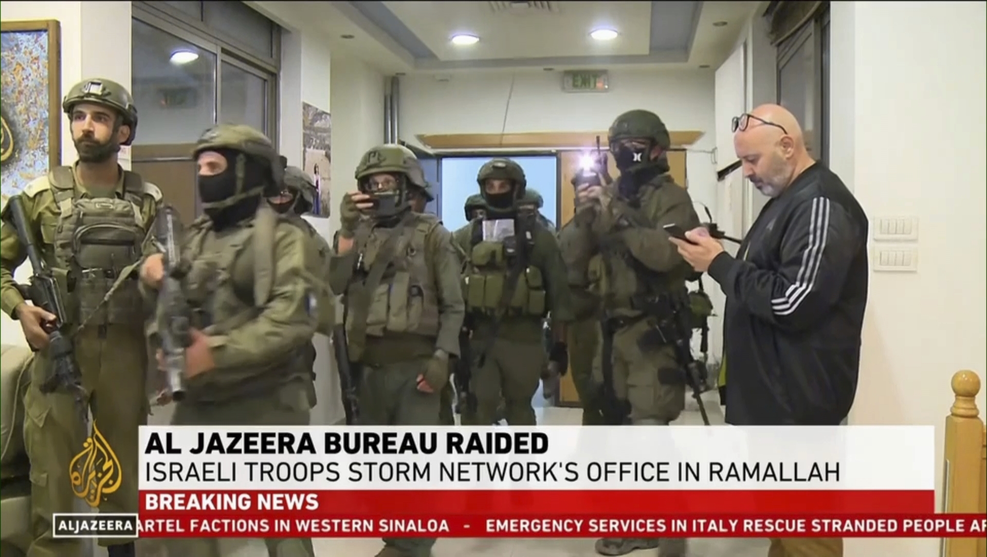 This image made from video provided by Al Jazeera English shows Israeli troops raiding their bureau in Ramallah, West Bank, Sunday, Sept. 22, 2024.