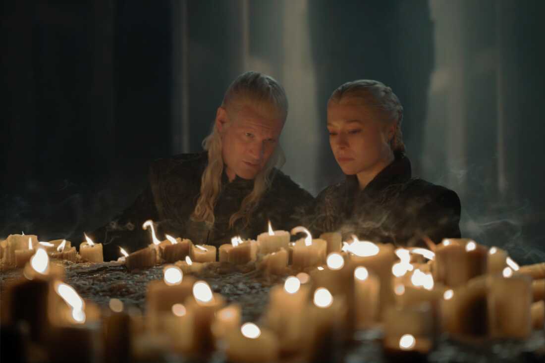 Daemon (Matt Smith) tells Rhaenyra (Emma D'Arcy) to blow them out and make a wish.