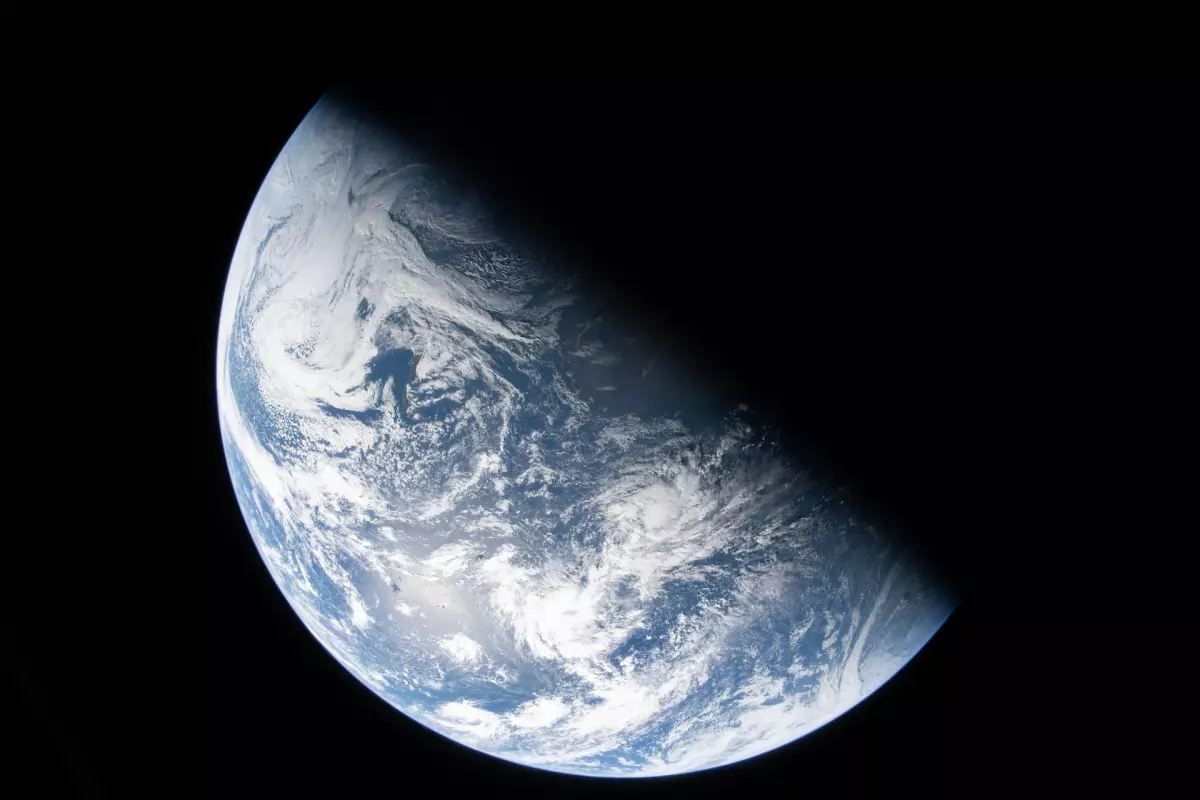 A view of Earth taken by NASA astronaut and Artemis II Commander Reid Wiseman from one of the Orion spacecraft's four windows after completing the translunar injection burn on April 2, 2026.