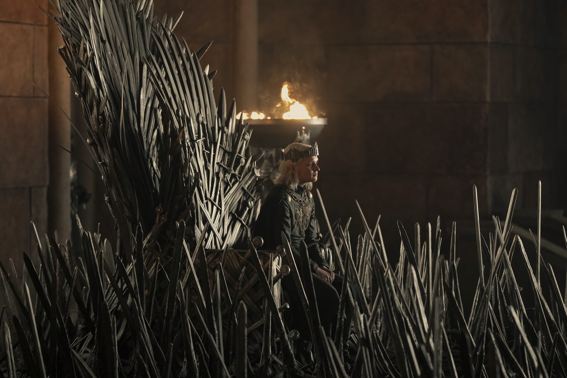 Aegon II (Tom Glynn-Carney) on the famously pointy and rusty Iron Throne.