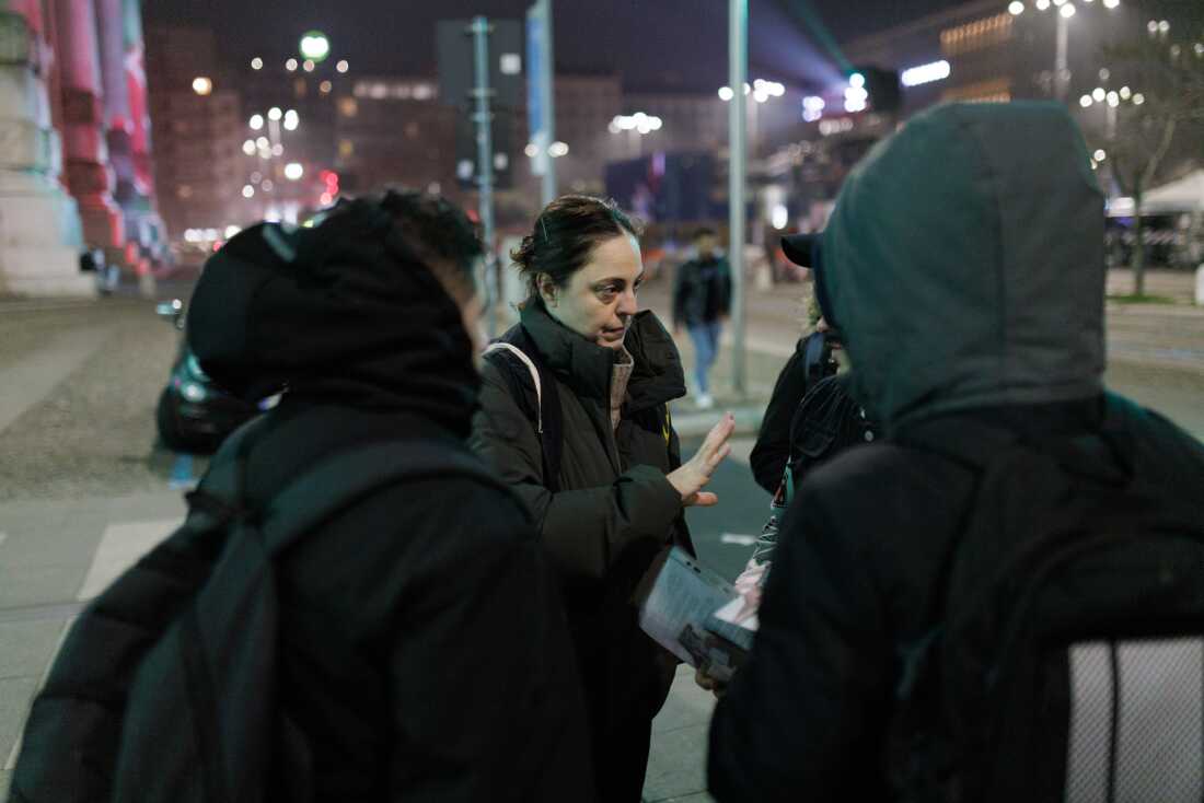 Members of an International Rescue Committee (IRC) outreach team patrol the main hall of Milano Centrale railway station during the night. The station remains a critical hub for migrants and homeless individuals seeking temporary refuge from the winter cold. Humanitarian organizations maintain a constant presence in the area to provide medical referrals, legal orientation, and basic necessities to vulnerable populations who often face displacement due to urban decorum policies and restricted access to public spaces in the city's transport hubs