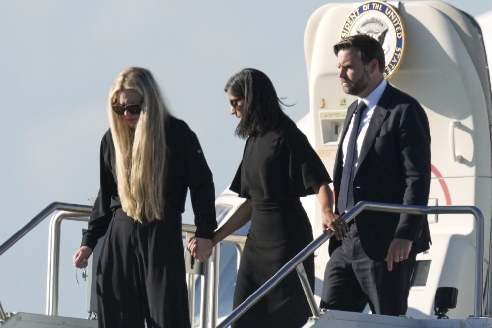 Vice President Vance (right) Second Lady Usha Vance (center) and Erika Kirk deplane Air Force Two, carrying the body of Charlie Kirk, the CEO and co-founder of Turning Point USA, on Thursday in Phoenix. (AP)