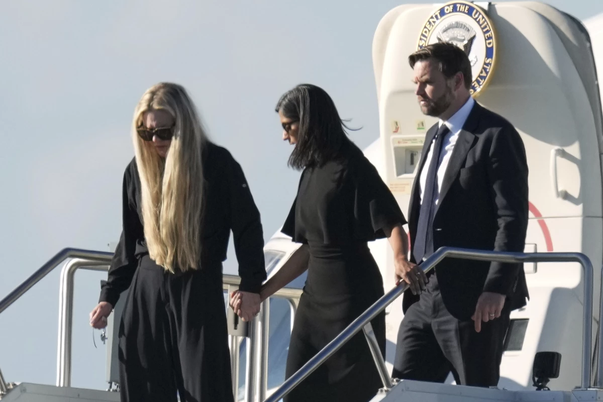 Vice President Vance (right) Second Lady Usha Vance (center) and Erika Kirk deplane Air Force Two, carrying the body of Charlie Kirk, the CEO and co-founder of Turning Point USA, on Thursday in Phoenix.