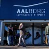 People walk outside Aalborg Airport in Denmark on Thursday, Sept. 25, 2025, after drones were observed on the airport on Wednesday evening and the night to Thursday, and the airspace over the airport was closed.