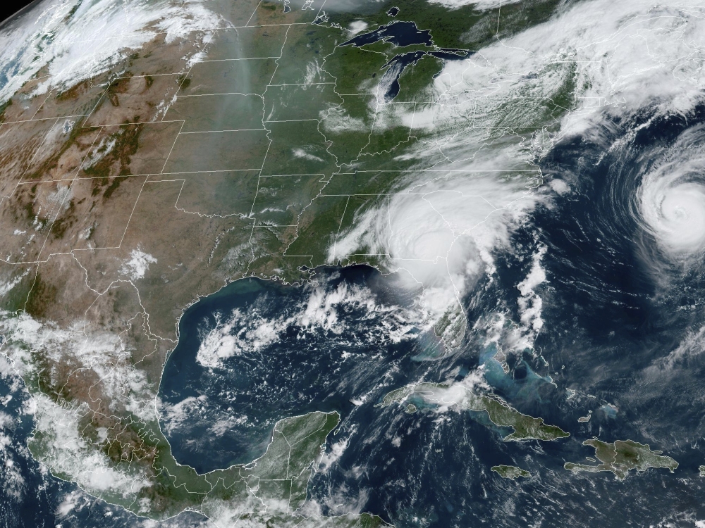 A satellite image provided by the National Oceanic and Atmospheric Administration shows Hurricane Idalia, center, over Florida and crossing into Georgia, and Hurricane Franklin, right, as it moves along off the East coast of the U.S., on Aug. 30, 2023. (NOAA)