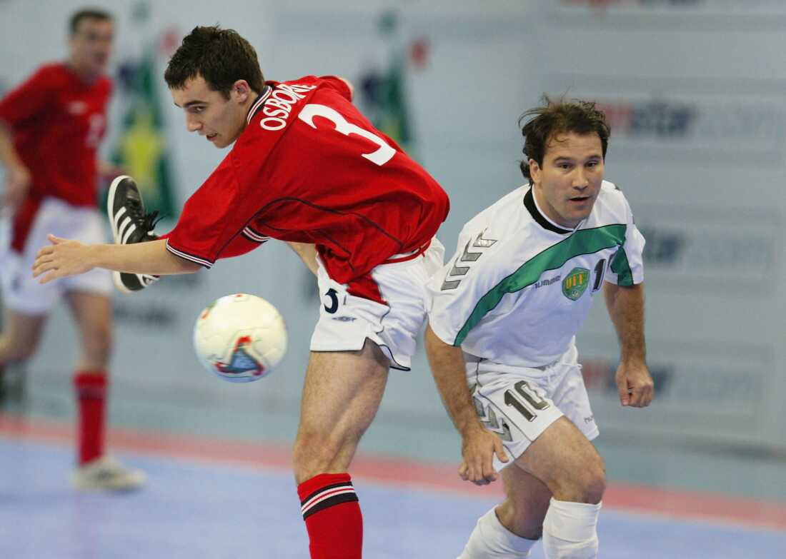 Paul Osborne of England battles for the ball with Abduraimov Azamat of Usbekistan during the 2003 World 5s Futsal Championship between England and Usbekistan JUNE 5 2003 at the Bukit Jalil Putra Stadium in Kuala Lumpur, Malaysia.