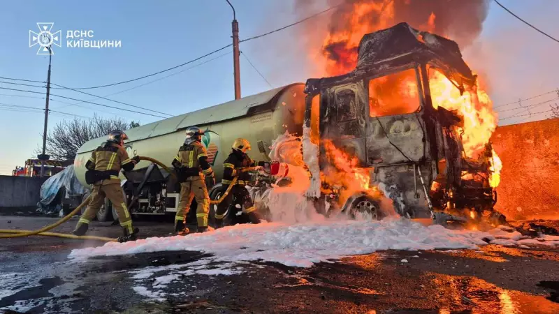 In this photo, provided by the Ukrainian Emergency Service, emergency services personnel work to extinguish a fire a vehicle following a Russian drone attack in Kyiv region, Ukraine, Tuesday, May 5, 2026.
