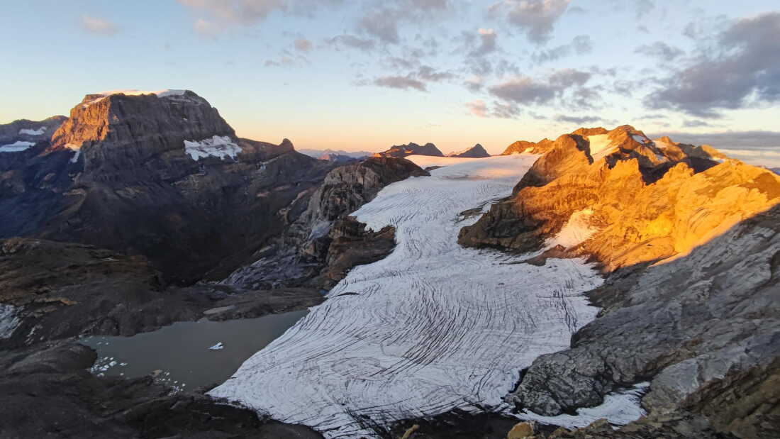 A Swiss glacier shows the effects of years of ice loss, with exposed rock replacing ice that once covered the landscape.