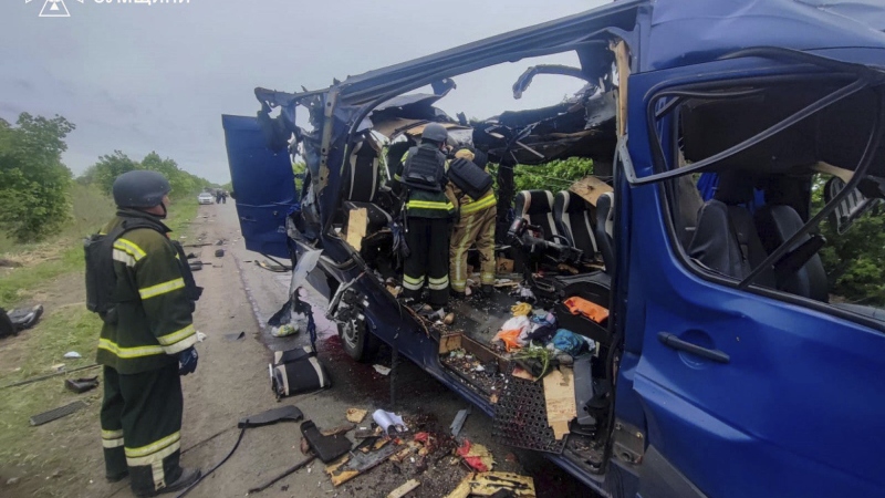 In this photo provided by the Ukrainian Emergency Service, rescuers recover the bodies of passengers after a Russian drone struck a passenger bus at the village of Bilopillya in the Sumy region, Ukraine, on Saturday.