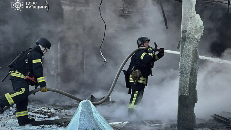 In this photo provided by the Ukrainian Emergency Service, firefighters put out the fire following Russia's drone attack in the Kyiv region, Ukraine, Sunday, May 18, 2025. 