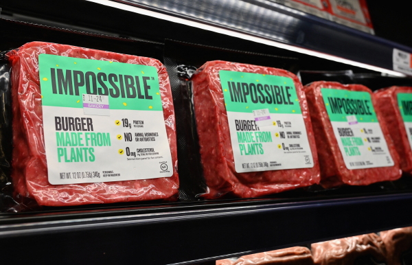 "Impossible Foods" burgers made from plant-based substitutes for meat products sit on a shelf for sale on November 15, 2019, in New York City.
