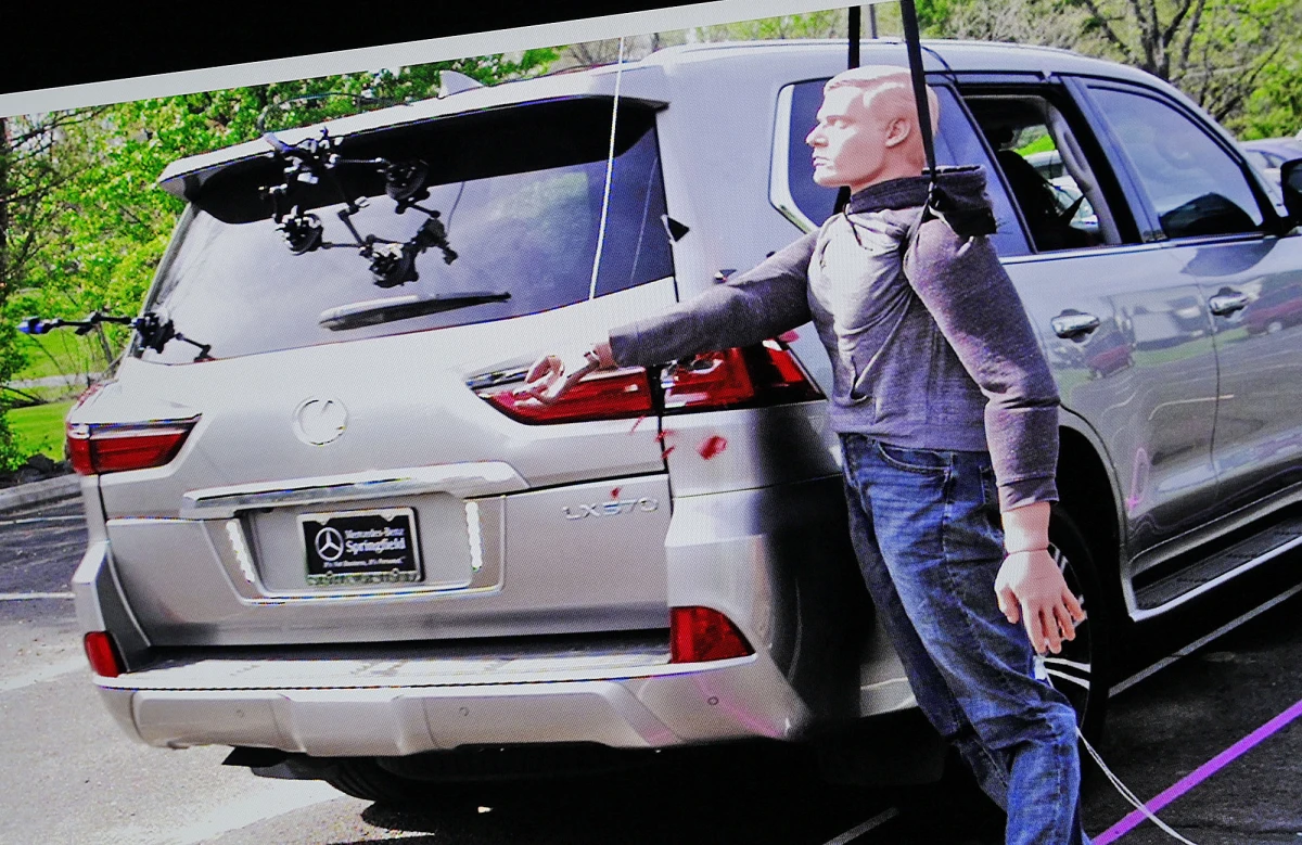 Still images from a reconstruction test show the shattering of an SUV taillight, displayed during the Karen Read retrial in Norfolk Superior Court in June.