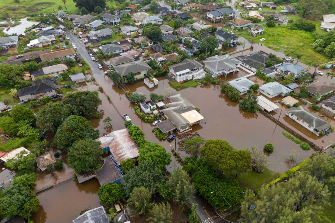 Streets are flooded due to heavy rain Friday in Haleiwa, Hawaii.