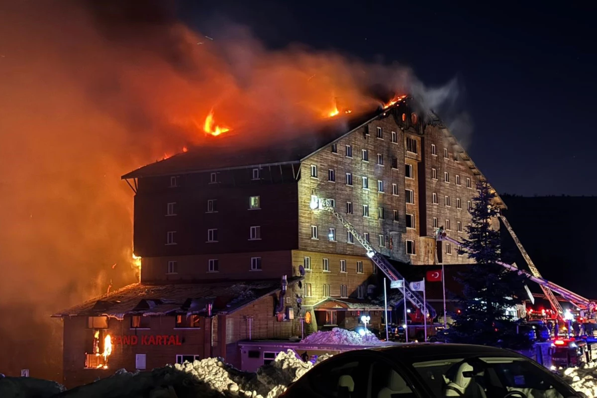 Firefighters work to extinguish a fire in a hotel at a ski resort of Kartalkaya in Bolu province, in northwest Turkey, on Tuesday.