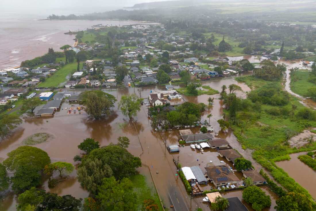 Streets are flooded due to heavy rain Friday in Haleiwa, Hawaii.