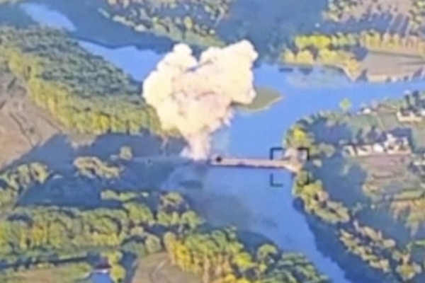 Smoke billows above a bridge on the Seym River in Russia's western region of Kursk. Ukraine's military released the footage on Sunday, saying this was the second bridge on the river it has destroyed in recent days. The bridge could have been a route for Russia to send in reinforcements to the area, where Ukrainian troops invaded Russia on Aug. 6.