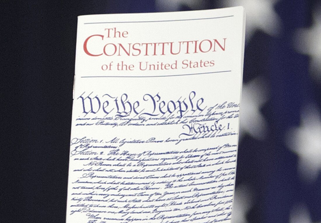 The Constitution is held by a member of Congress on Capitol Hill in Washington on March 23, 2016.
