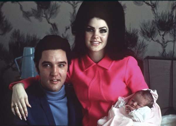 Elvis Presley poses with wife Priscilla and daughter Lisa Marie, in a room at Baptist hospital in Memphis, Tenn., on Feb. 5, 1968.