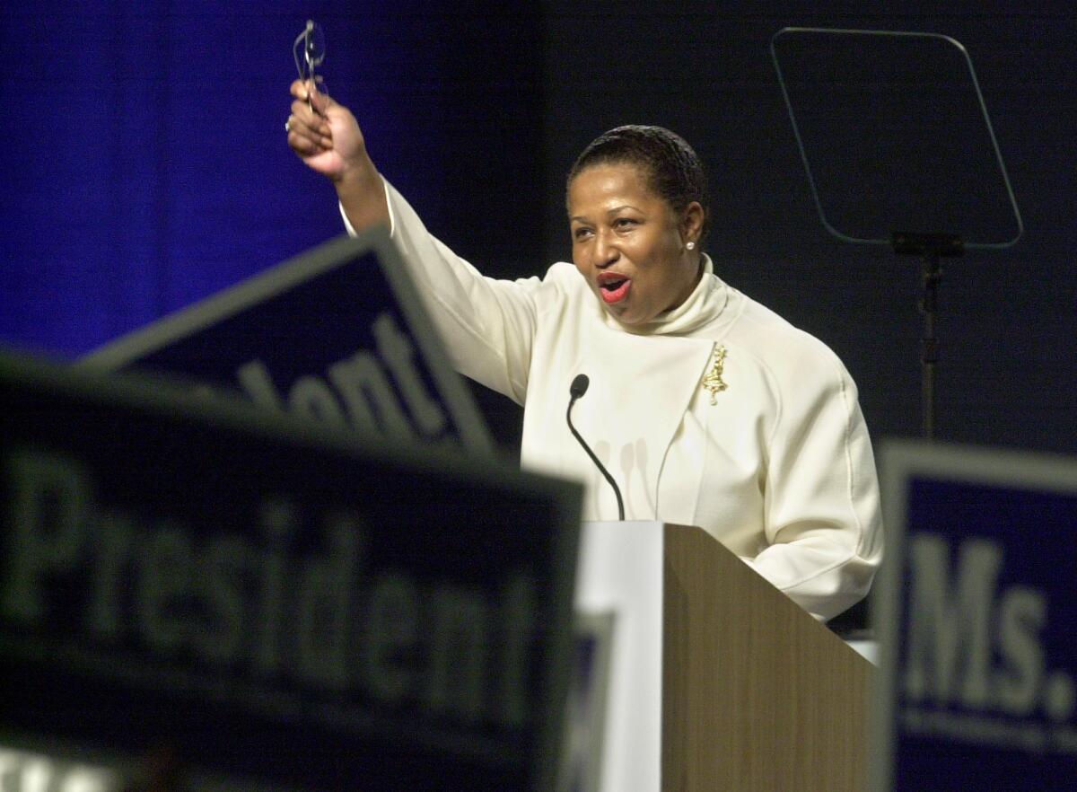 Democratic presidential candidate, former Illinois Sen. Carol Moseley Braun waves to sign waving supporters during her speech at the California Democratic Party State Convention in Sacramento, Calif., Sunday, March 16, 2003.