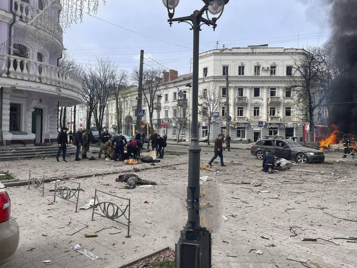 In this photo provided by the Ukrainian Parliament Commissioner for Human Rights Press Service, bodies of the killed residents lie on the ground following a Russian missile attack that killed at least civilia civilians in Sumy, Ukraine, Sunday, April 13, 2025.