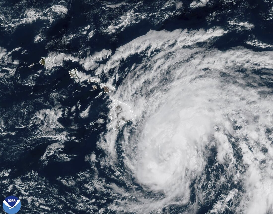 This image provided by the National Oceanic and Atmospheric Administration shows Tropical Storm Hone as it continues to track to the west toward the Hawaiian Islands on Saturday.