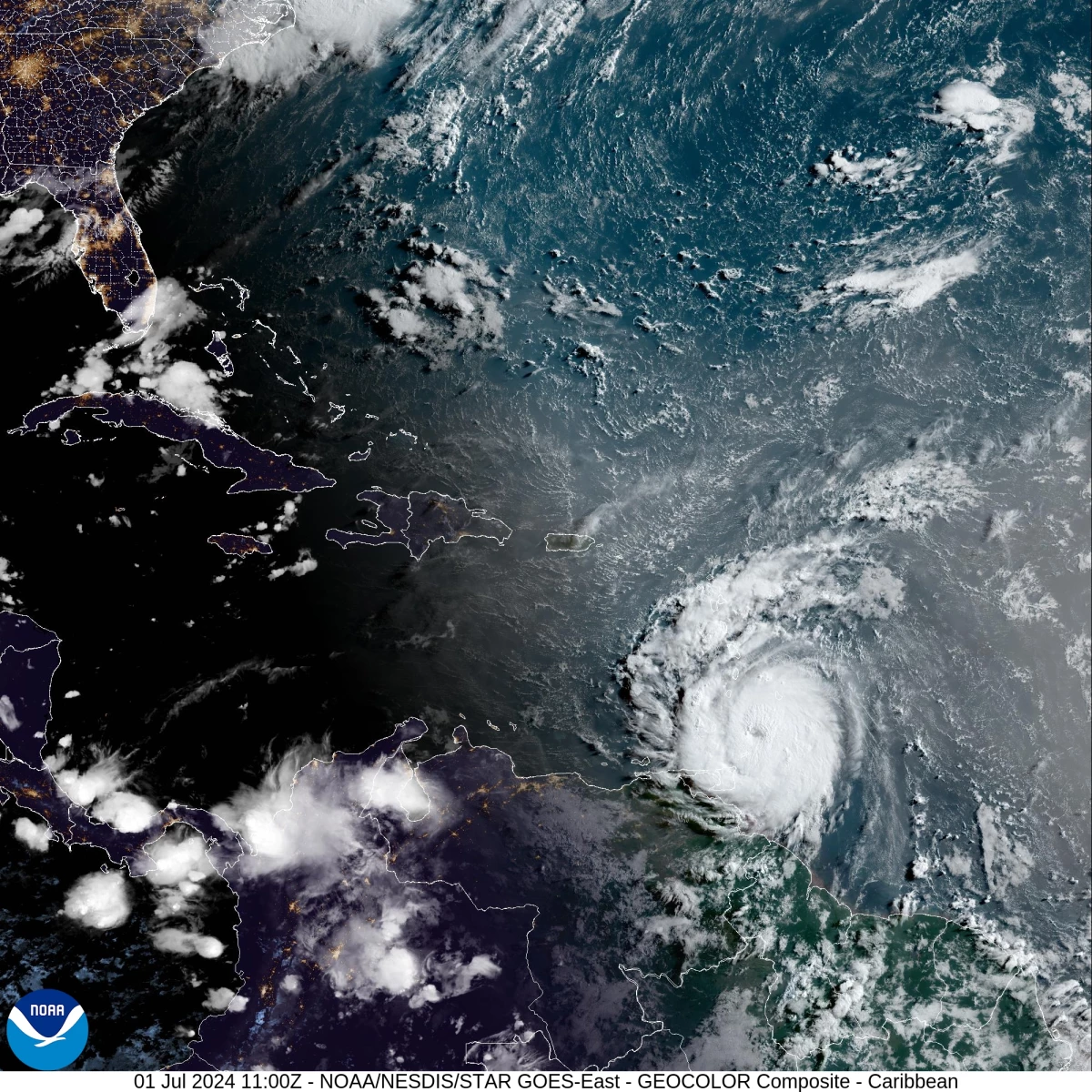 Hurricane Beryl loomed toward St. Vincent — and grew in power — as it brought threats of catastrophic winds and dangerous storm surges to the Windward Islands. The storm is seen here in a satellite image just after sunrise on Monday.