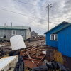 The remnants of typhoon Halong floated homes off their foundations and washed debris across the Western Alaska village of Kwigillingok on Thursday, Oct. 16, 2025. Residents lost boats, four-wheelers and snowmobiles/snowmachines — some of which scattered miles away from the community.