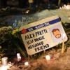 A sign for 37-year-old Alex Pretti, who was fatally shot by a U.S. Border Patrol officer earlier in the day, is displayed during a vigil Saturday, Jan. 24, 2026, in Minneapolis.