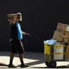 An Amazon worker delivers packages in Los Angeles.