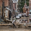 Workers, community members and business owners clean up debris in the aftermath of Hurricane Helene in Marshall, N.C., on Sept. 30.
