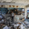 Civil defense teams and civilians carry out search and rescue operations from the rubbles after an Israeli attack at the school of United Nations Relief and Works Agency for Palestine Refugees in the Near East (UNRWA) at Nuseirat Refugee Camp in the Gaza Strip on Wednesday.