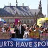 Ralph Regenvanu, Vanuatu's minister for climate change, is joined by climate activists at the International Court of Justice. The country pushed for years for the court to hear its first major climate change case.