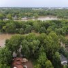 This aerial photo provided by the Indianapolis Fire Department shows flooding in northern Indianapolis, Ind., Saturday, Aug. 15, 2026.