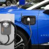 A Powering Michigan display about electric vehicles and charging is shown at the 2025 Detroit Auto Show on Jan. 10. The Biden administration promoted electric vehicles through a range of policies, which the Trump administration is in the process of reversing.